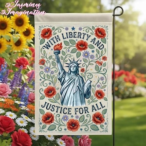 May include: A garden flag featuring the Statue of Liberty holding a torch and tablet, surrounded by red poppies and floral designs. The flag reads "With Liberty and Justice for All" in a decorative font.