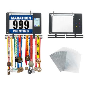May include: A black metal medal display board with a "MARATHON 999 PRINTING" sign, a clear display pocket, and a stack of clear plastic sleeves. Several colourful race medals hang from the board.
