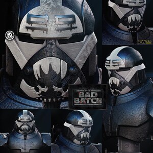 Könnte beinhalten: Eine Wrecker The Bad Batch Star Wars Büste mit einem dunkelblauen und silbernen Helm, einem totenkopfartigen Design und der Nummer 99 auf der Stirn. Der Helm hat ein verwittertes Finish, einen weißen Streifen und eine gezackte Mundgrafik. Der Sockel zeigt den Text Star Wars The Bad Batch.