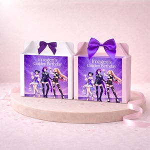 May include: Two rectangular gift boxes with handles, one white and one light pink, each topped with a purple satin bow. The front of each box features a graphic of three anime-style characters and the text Imogen's Golden Birthday in white.