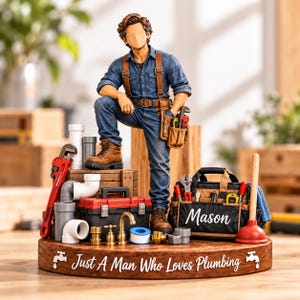 May include: A figurine of a plumber wearing a blue denim shirt and jeans with brown boots, standing on a wooden base labeled "Just A Man Who Loves Plumbing". The base features a tool bag with "Mason" printed on it, pipes, and tools.
