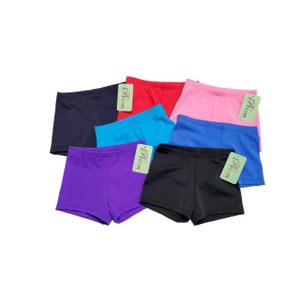 May include: Six pairs of black, red, pink, blue, turquoise, and purple spandex shorts. The shorts are all the same style and have a small tag that says "Prism" on them.