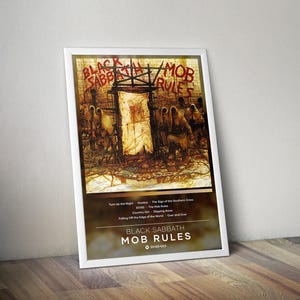 May include: A framed poster featuring the Black Sabbath Mob Rules album artwork. The top section displays the original cover illustration, while the bottom section lists the tracklist, the album title, and a Spotify code on a dark background.
