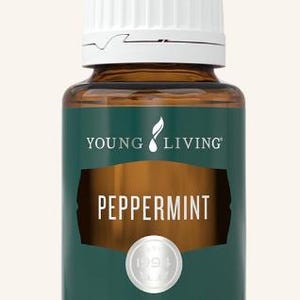 May include: A small glass bottle of Young Living Peppermint essential oil. The bottle has a white cap and a dark green label with the word "PEPPERMINT" in large letters. The bottle contains 0.5 fl. oz. (15 ml) of oil.