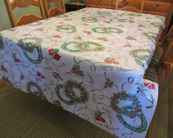 Vintage Plastic  Vinyl Tablecloth Merry Christmas in Cursive Wreaths Holly Berries Shiny Brites Bells Gold No Backing 54 x 86 1 Sm Slit EVC