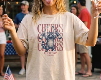 Poppin' Bottles Raccoon Shirt, Cheers To 250 Years, Comfort Colors 1717, USA 250th Anniversary, Trash Panda Gift, Chaotic 4th Of July Tee