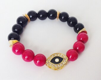 Evil Eye Schwarzer Onyx & Pink Fossilien Perlen Stretch Armband