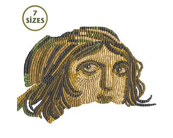 May include: An embroidered design of a face with long hair, in gold, brown, and green. The image has a mosaic-like appearance. A circular emblem in the upper left corner reads "7 SIZES".