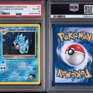 May include: A graded Pok&eacute;mon card featuring Giovanni's Gyarados. The card has a blue and yellow design with a holographic image of a blue dragon-like creature. The card is encased in a protective plastic case with a PSA grade of 6.