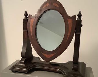 Antique Seth Thomas mahogany tabletop swing mirror