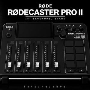 May include: A black RØDE RØDECASTER PRO II audio production console featuring a 15-degree ergonomic stand, a central touchscreen, six vertical faders with white caps, a large rotary knob, and a grid of eight square buttons on the right side.