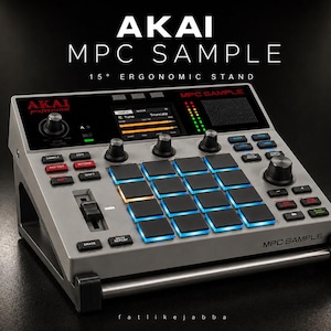 May include: A silver AKAI MPC Sample music production centre with a 15-degree ergonomic stand. The device features numerous buttons, knobs, and illuminated pads. The text "AKAI MPC SAMPLE" is displayed on the device.