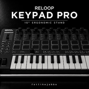 May include: A black Reloop Keypad Pro MIDI controller with a 25-key keyboard, multiple drum pads, rotary knobs, and faders. The device is mounted on a 15-degree ergonomic stand. The text RELOOP KEYPAD PRO 15° ERGONOMIC STAND is visible above.