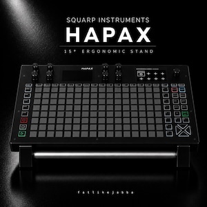 May include: A black Squarp Instruments Hapax music sequencer mounted on a 15-degree ergonomic stand. The device features a grid of square buttons, multiple rotary knobs, a central display screen, and various control buttons with text labels.