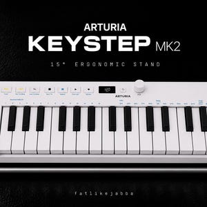May include: A white Arturia KeyStep MK2 MIDI keyboard controller with black and white keys, various control buttons, a small digital display, and a rotary knob, mounted on a 15 degree ergonomic stand with a silver metal bar and black supports.