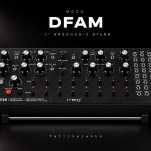 May include: A black Moog DFAM semi-modular analog percussion synthesizer on a 15-degree ergonomic stand. The unit features numerous silver knobs, a red button, and a patch bay on the right side, with wood side panels and white text labels.