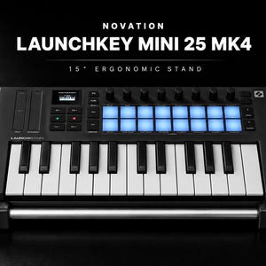 May include: A black Novation Launchkey Mini 25 MK4 MIDI keyboard controller featuring 25 keys, a grid of 16 backlit blue pads, rotary knobs, and a small display screen. The device is mounted on a 15-degree ergonomic stand with a silver metal bar.