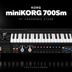 May include: A black Korg miniKORG 700Sm synthesiser featuring a white keyboard, multi-coloured sliders, and knobs. The unit is mounted on a 15-degree ergonomic stand. The control panel includes various labelled settings and switches for sound modulation.