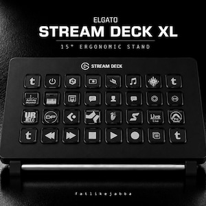 May include: A black Elgato Stream Deck XL control console featuring a grid of thirty-two customizable LCD keys with various icons. The device is mounted on a 15-degree ergonomic stand with a silver metal support bar across the front base.