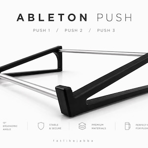 Puede incluir: Soporte negro y plateado para Ableton Push. El soporte tiene un ángulo ergonómico de 15 grados y está hecho de materiales de primera calidad. El texto de la imagen dice "ABLETON PUSH" y "PUSH 1 / PUSH 2 / PUSH 3".