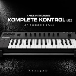May include: A black Native Instruments Komplete Kontrol M32 MIDI keyboard controller resting on a 15-degree ergonomic stand. The device features white and black keys, multiple control knobs, and buttons. The text reads NATIVE INSTRUMENTS KOMPLETE KONTROL M32 15° ERGONOMIC STAND.