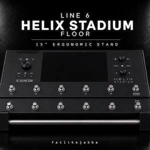 Puede incluir: Un soporte ergonómico negro Line 6 Helix Stadium Floor de 15 grados con una pantalla central, múltiples perillas de control y dos filas de interruptores de pie metálicos. El texto Line 6 Helix Stadium Floor 15 degree ergonomic stand es visible.