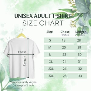 May include: White unisex adult t-shirt hanging on a wooden hanger, with a size chart. The chart lists sizes S to 3XL, with chest measurements from 18 to 28 inches and lengths from 28 to 33 inches. Text on the image reads: "UNISEX ADULT T-SHIRT SIZE CHART."