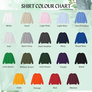 May include: A color chart displaying various sweatshirt colors. Colors include white, sand, light pink, light blue, Carolina blue, ash, sport grey, dark heather, navy, royal blue, Irish green, military green, purple, black, gold, orange, red, and maroon.