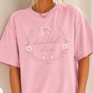 Dumbbell Diva T-Shirt & Sweatshirt, Coquette Gym Tee, Pink Bow Workout Shirt, Floral Weightlifting Tee, Girly Gym Shirt, Pilates Shirt