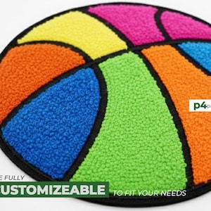 Op de afbeelding: Een kleurrijke basketbalpatch met een zwarte rand. De patch heeft secties in oranje, blauw, groen, geel en roze. De tekst "SIZE FULLY CUSTOMIZEABLE TO FIT YOUR NEEDS" staat onderaan.