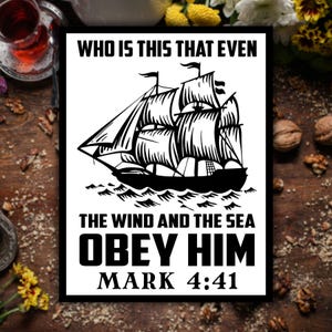 May include: Black and white framed print featuring a detailed illustration of a sailing ship on the sea. The text reads "WHO IS THIS THAT EVEN THE WIND AND THE SEA OBEY HIM MARK 4:41".