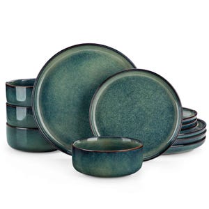 May include: A teal-colored dinnerware set featuring plates and bowls. The set includes large and small plates, along with several bowls. The plates and bowls have a speckled texture and a dark rim. The set is designed for serving meals.