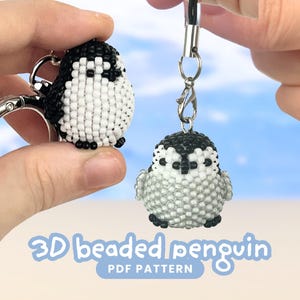 May include: Two 3D beaded penguin charms made from small black, white, and grey seed beads. One penguin is attached to a silver metal keyring, and the other hangs from a black cord with a silver lobster clasp. Text reads 3D beaded penguin PDF pattern.