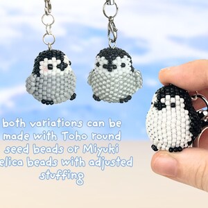 May include: Three small penguin-shaped keychains crafted from black, white, and grey seed beads. The text reads: both variations can be made with Toho round seed beads or Miyuki Delica beads with adjusted stuffing. Each keychain has a metal clasp.
