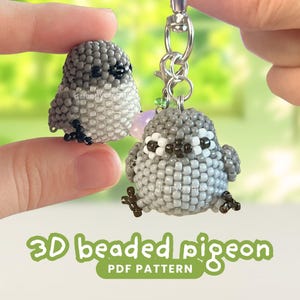 May include: Two small, three-dimensional beaded pigeon figures crafted from grey, white, and black seed beads. One pigeon is attached to a silver metal keychain clasp, while the other is held separately. The text 3D beaded pigeon PDF PATTERN is visible.