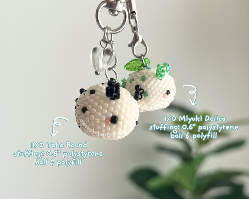 May include: Two round beaded charms with silver lobster clasps. One features 11/0 Toho Round beads with a 0.8-inch polystyrene ball and polyfill. The other uses 11/0 Miyuki Delica beads with a 0.6-inch polystyrene ball and polyfill. Both have small heart charms.