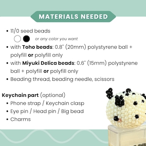 May include: A craft instruction card titled MATERIALS NEEDED listing 11/0 seed beads, 0.8 inch and 0.6 inch polystyrene balls, polyfill, thread, needle, and scissors. A small, round, white beaded sphere with black accents sits in the corner.