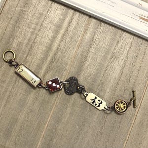 Industrial Steampunk Charm Bracelet: Red Dice, Ruler, Metal Accents