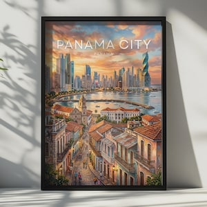 May include: A framed wall art print depicting a sunset view of Panama City, Panama. The scene features a cobblestone street with colonial-style buildings in the foreground, leading to a bay with boats and a modern skyline with skyscrapers.