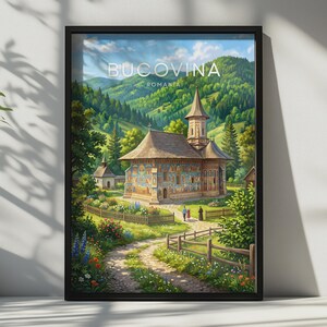 May include: A framed travel poster featuring a painted landscape of a Bucovina, Romania church with intricate exterior murals. The scene includes a dirt path, wooden fences, lush green hills, and a blue sky with white clouds. The text reads BUCOVINA ROMANIA.