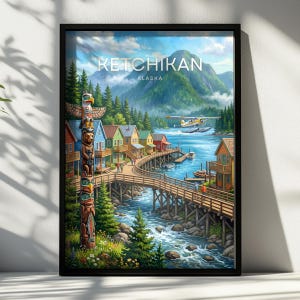 May include: A framed travel poster of Ketchikan, Alaska, featuring a tall, colourful totem pole in the foreground, a wooden boardwalk along a river, vibrant houses, a seaplane flying over the water, and lush green mountains under a blue sky.