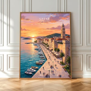 May include: A framed print of Split, Croatia, at sunset. The artwork shows a coastal city with a promenade, boats, and a historic tower. The sky is a blend of orange and purple hues, reflecting on the water. The print is in a gold frame.