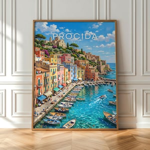 May include: A framed art print of Procida, Italy, featuring a vibrant coastal scene. The artwork depicts colorful buildings, boats in a turquoise harbor, and the text "PROCIDA ITALY" at the top. The print is displayed on a wooden floor against a white wall.