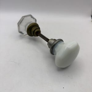 2 Antique  8 Point Glass Door Knobs - 1 white milk glass, 1 Clear, With Rod