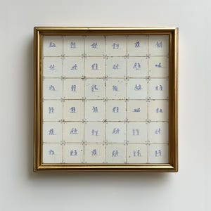 May include: A square wall art piece featuring a grid of thirty-six off-white ceramic tiles framed in gold. Each tile displays a small, blue hand-painted illustration of figures in various poses, creating a uniform pattern across the entire display.