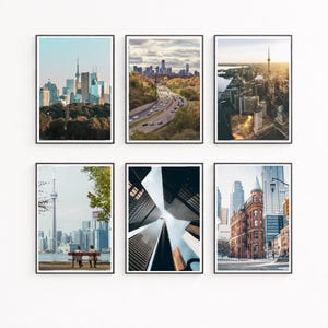 May include: Six framed art prints featuring Toronto cityscapes. The prints showcase various views, including the skyline, highways, and architectural details. The color palette includes blues, greens, and browns, with a focus on urban photography.