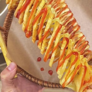 May include: A white ceramic mug with a black handle and the text "But First, Coffee" in a bold, black font. The mug is on a wooden surface. The mug is approximately 10 cm tall.