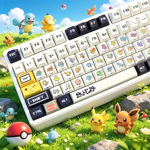 May include: A white mechanical keyboard featuring custom keycaps decorated with various small colorful creature illustrations. The keyboard includes black function keys, a yellow tab key, and the Japanese text "ポケットモンスター" printed on the spacebar.