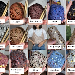 May include: A collection of fifteen yarn balls featuring various colors including black, copper, dark chocolate, blue, black and gold, light gray, milk chocolate, dusty beige, pinkish beige, wine, dark brownish bordo, linen, light blue, and champagne.