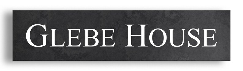 May include: A rectangular sign featuring the text "GLEBE HOUSE" in a white serif font. The sign has a dark grey, textured background, possibly stone or a similar material. The sign is designed for mounting.
